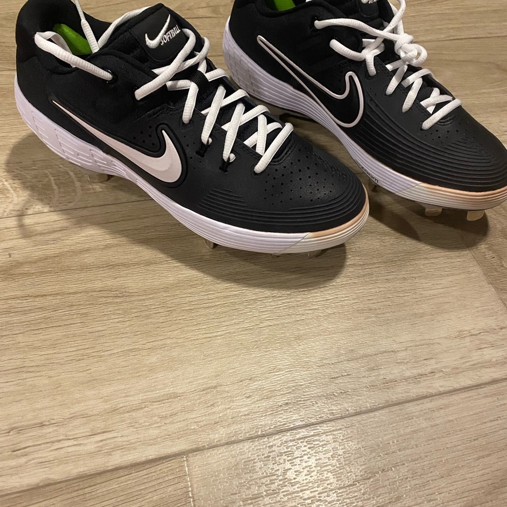 Nike Black and White Cleats with Green Accents